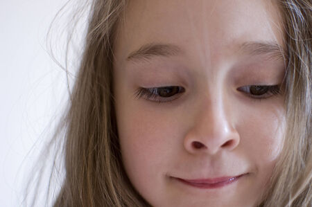 isolated portrait of a posing beautiful young girlの写真素材