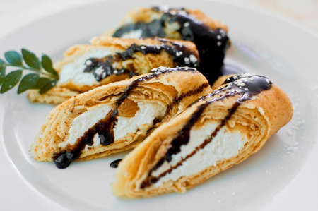 close-up of pancakes with farmer cheese  curds , covered with chocolate