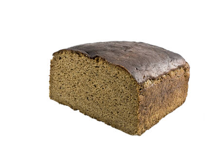 loaf of brown bread isolated against white