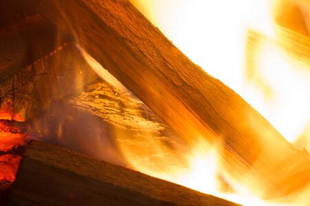 Burning wood. Firewood in the fireplace. Shallow depth of field