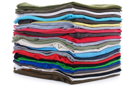 pile of colored shirts isolated on white background