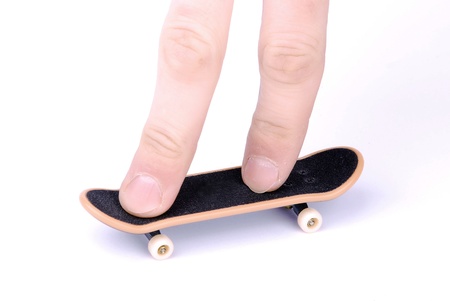 fingers on the skateboard for your fingers on a white backgroundの写真素材