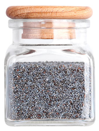 Poppy seeds in a glass bottle. Isolated on white backgroundの写真素材