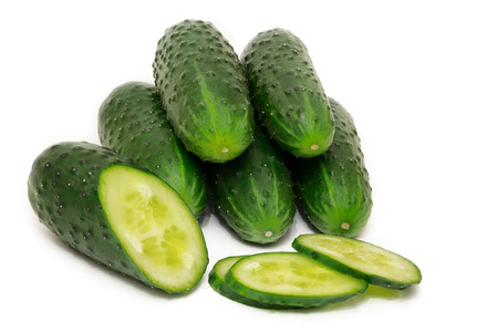 Group of ripe green juicy cucumbers isolated on white の写真素材