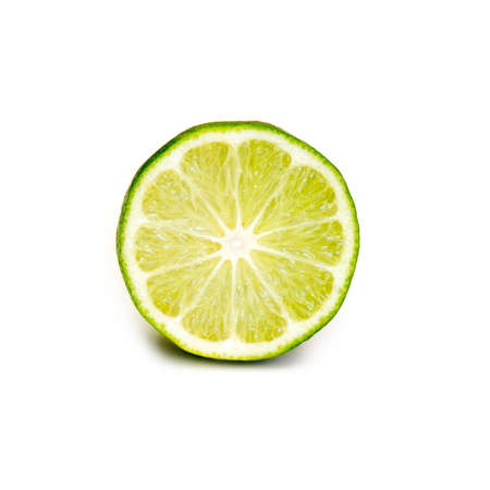 Ripe juicy cut lime isolated on white backgroundの写真素材