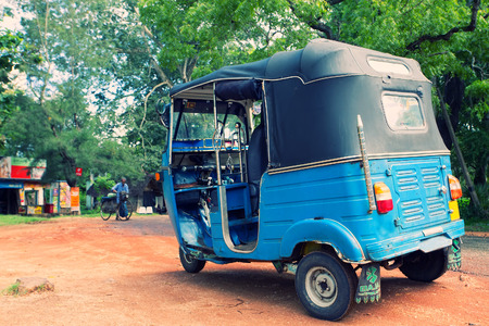 Asian taxi (tuc-tuc, tuk-tuk, tuck-tuck, tri-wheel, tricycle)