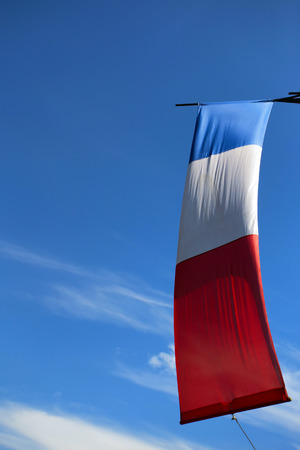 Beautiful waving flag of France on sky backgroundの写真素材