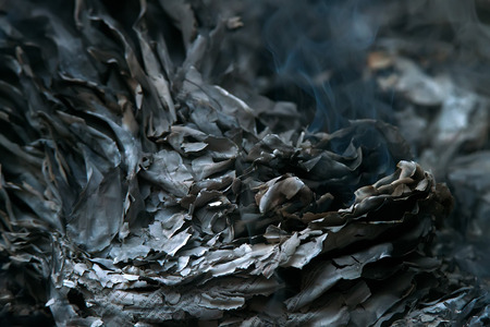 Burnig paper pages and remaining ashes and ember