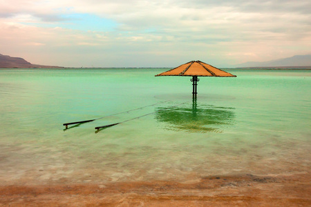 Vivid seascape of the shores and surface of the Dead Seaの写真素材