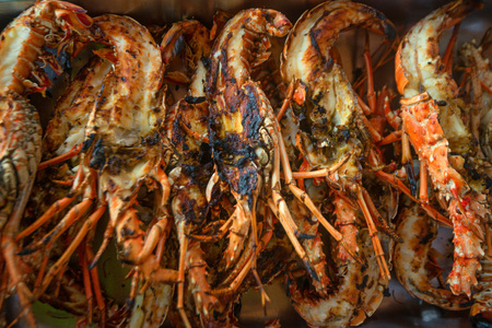 Many tasty prepared lobsters cut into two pieces