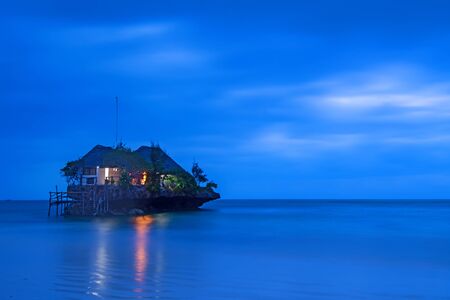 Rock romantic restaurant in Indian ocean near Zanzibar coastlineのeditorial素材