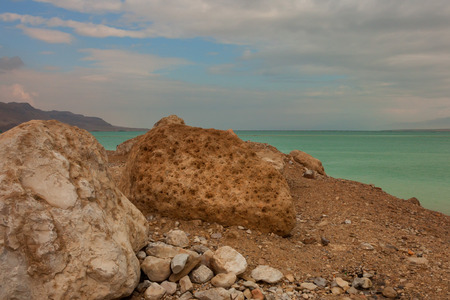 Vivid seascape of the shores and surface of the Dead Seaの写真素材