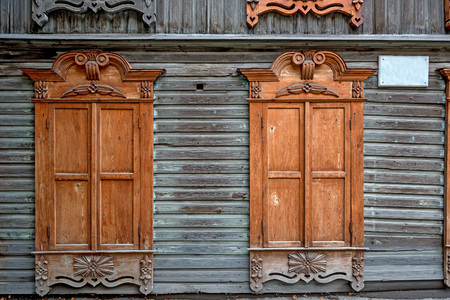 Old vintage weathered wooden window of ancient Russian houseの写真素材