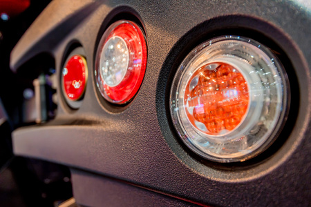 Close-up photography of headlights of modern tractor or harvesterの写真素材