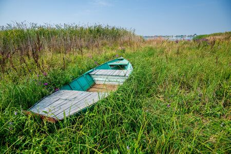 Tranquil image of an old boat on a riverの写真素材