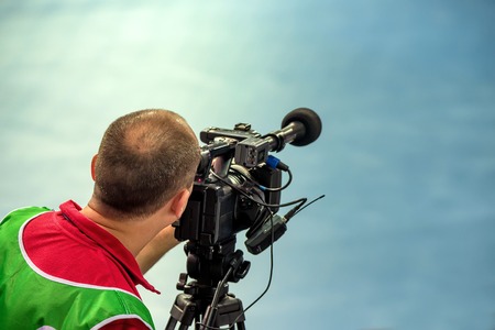Cameraman is filming the sport event for on-line broadcastingの写真素材