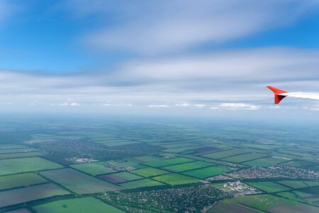 Awesome skyscape viewed from board of airplaneの写真素材