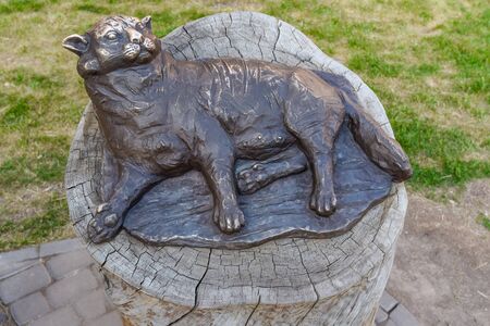 Bronze sculpture of fat lying cat in Kazanの写真素材