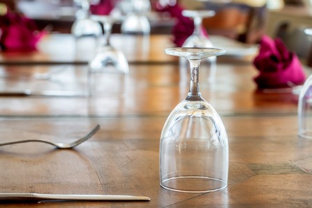 Elegant served table with wine glasses indoorsの写真素材