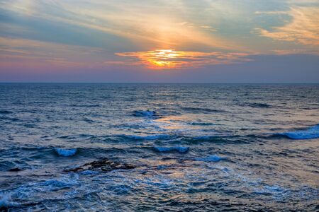 Sunset on tropical coastlineの写真素材