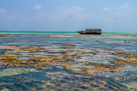 Scenic view of ocean and fisherman boatの写真素材