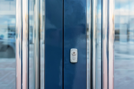 Close-up of glass office doors with keyholeの写真素材