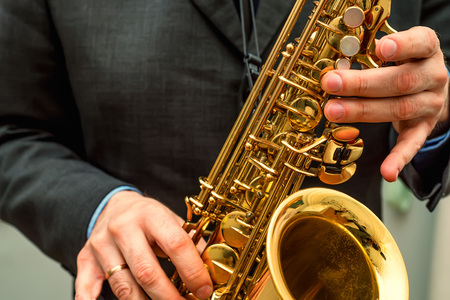 Hands of saxophone playerの写真素材