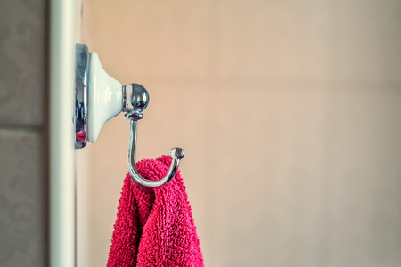Towel hangs on the wall in bathroomの写真素材
