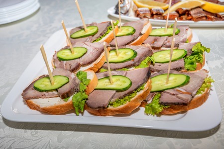 Smoked ham canape on plateの写真素材