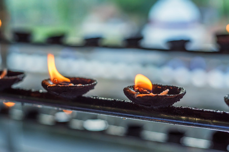 Coconut oil lamps in templeの写真素材