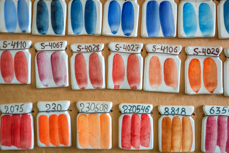 Pottery paint samples on wallの写真素材