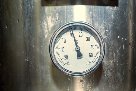 Alcohol thermometer on wine tank
