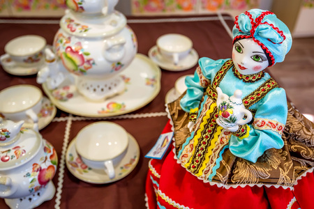 Beautiful delft doll in costume part of tea setの写真素材