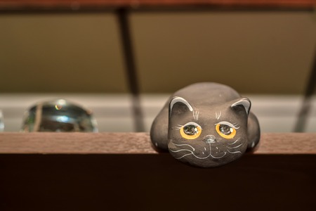 Small figurine of black ct on shelfの写真素材