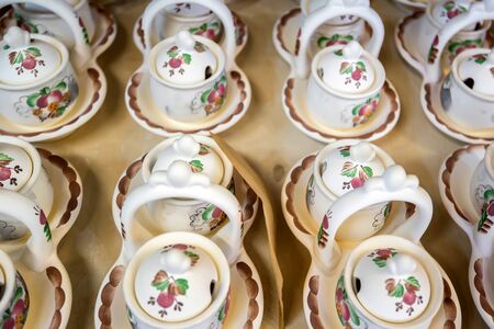 Group painted earthenware tableware before glazingの写真素材