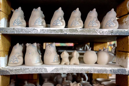 White unpainted earthenware figurinesの写真素材