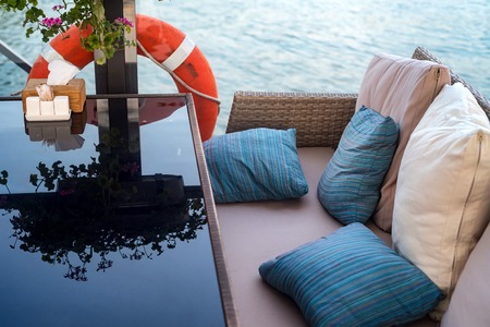 Interior of restaurant on water, sofa and tableの写真素材