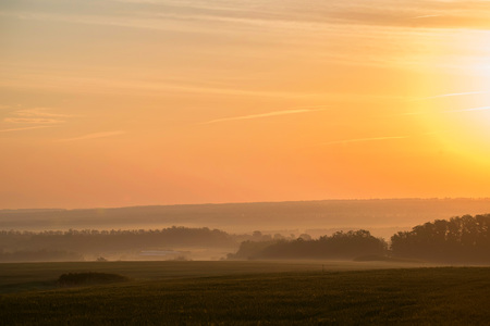 Beautiful view of misty sunrise in valleyの写真素材