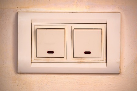 Beige rocker light switch with two buttonsの写真素材