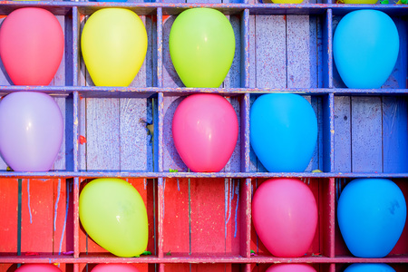 Bright baloons in cells at balloon dartsの写真素材