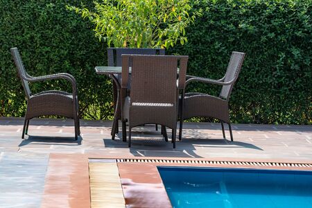 Deck chairs near the swimming poolの写真素材