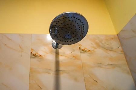Hard water deposit and rust on shower tap