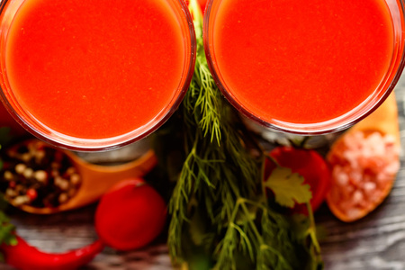 Glass of tomato juice with fresh tomatoesの写真素材