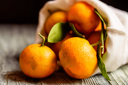 Mandarine orange or tangerine on wooden boardの写真素材