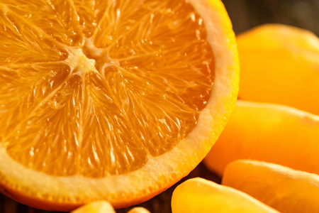 Ripe juicy fresh oranges, whole, cut and slicesの写真素材