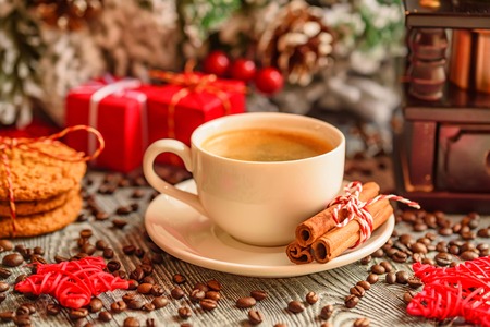 Cozy winter setting with cup of coffeeの写真素材