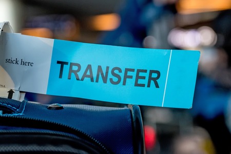 Close up photograph of luggage with transfer labelの写真素材