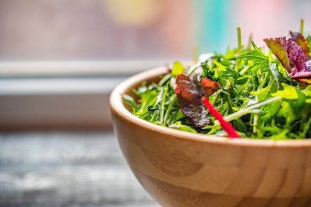 Fresh rustic vegetable salad on rustic backgroundの写真素材
