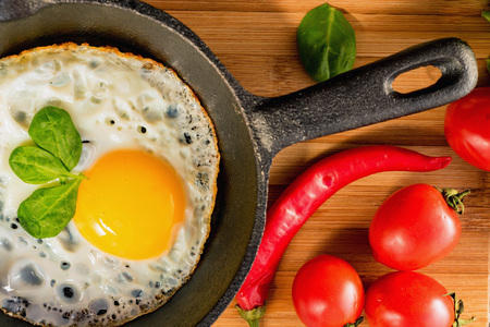 Fried eggs in a frying pan. Rustic breakfastの写真素材
