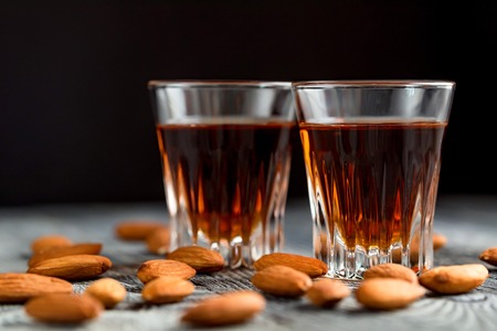 Italian amaretto liqueur with dry almondsの写真素材